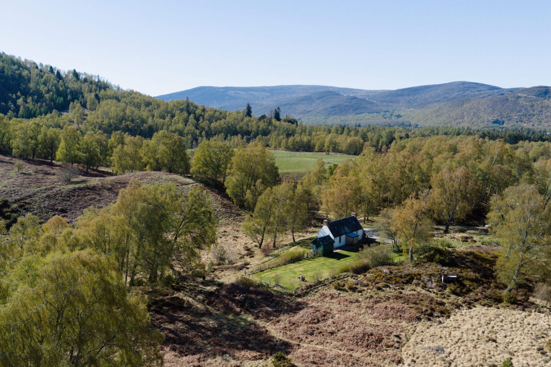 Aerial view of the valley and Cairngorm hills at Cairn Valley Cottage, Rothiemurchus, Aviemore