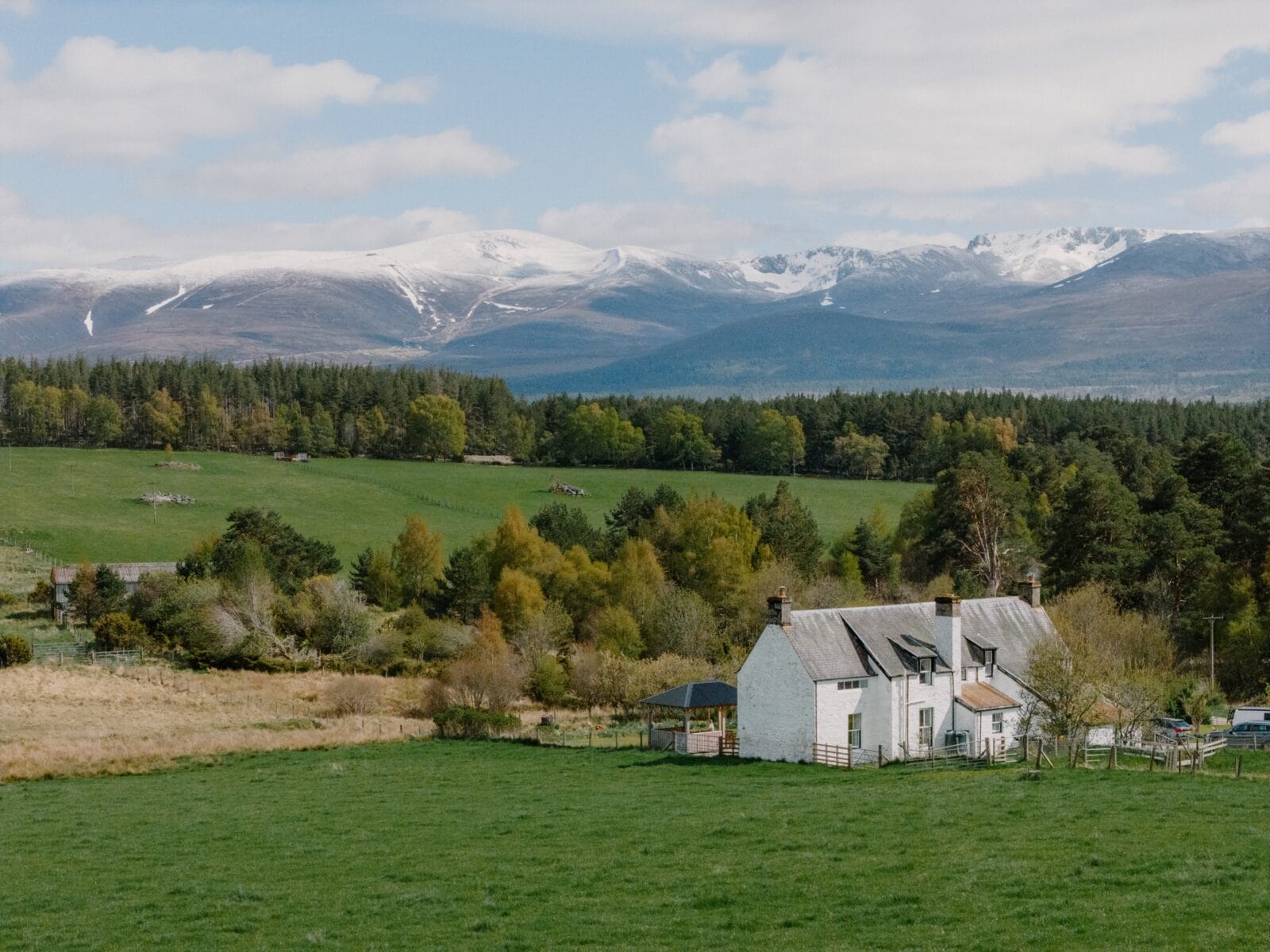 House set in open countryside below the Cairngorms at Achnahatnich House, Rothiemurchus, Aviemore